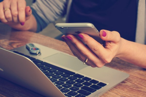 checking accounting on a phone and computer